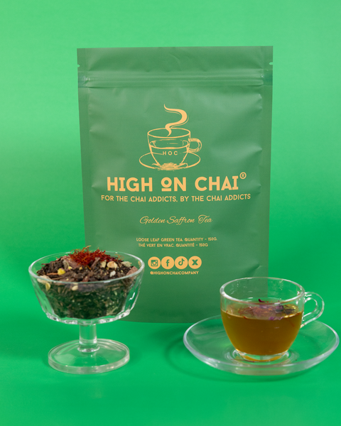 Green tea packaging with a cup of tea and loose tea leaves on a green background