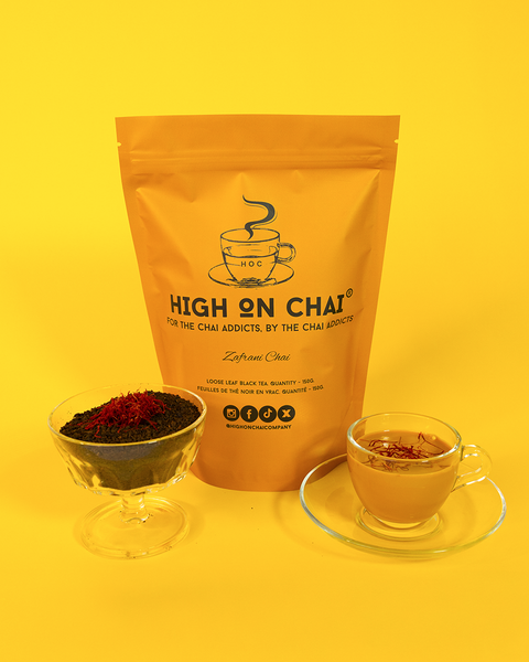 Bag of 'High on Chai' with a cup of chai and ingredients on a yellow background